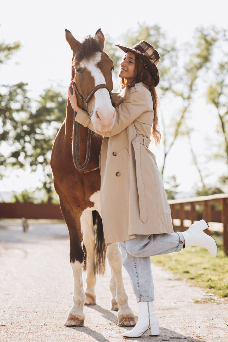 Image of Young woman with ranch horse